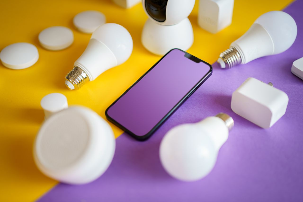 services-03 Colorful flat lay of smart home devices and smartphone on vibrant background, ideal for technology concepts.